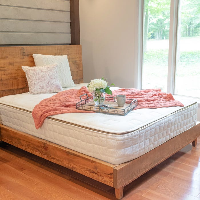  Naturepedic Organic Mattress - EOS Trilux with a bed frame. 